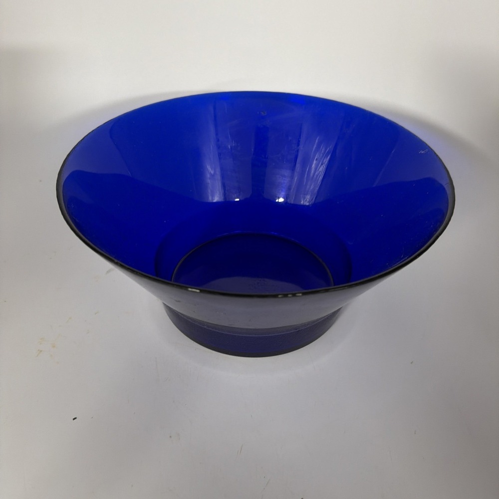 vintage cobalt blue glass bowl with a flared rim and a footed base